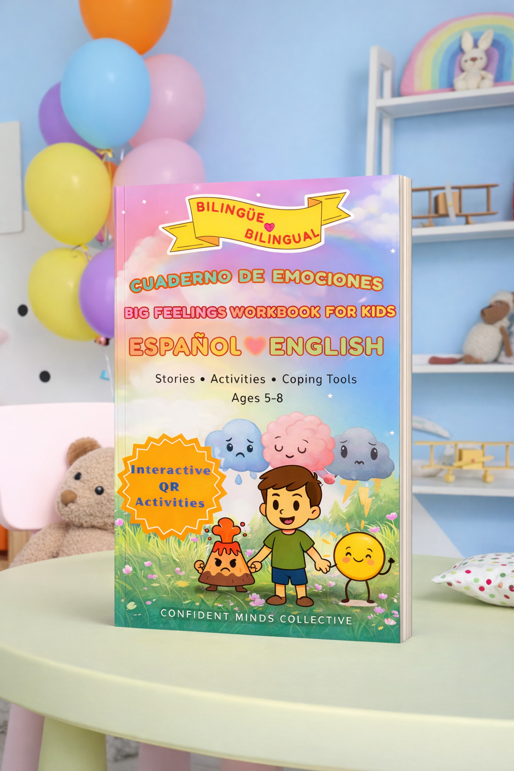 Big Feelings Workbook for Kids in Spanish and English on a table with balloons and toys in the background